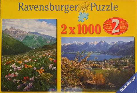 Puzzle Ravensburger 2×1000 detalių rinkinys su geltonu dėklu ir dviem kalnų peizažais — pievų gėlės ir ežero panorama