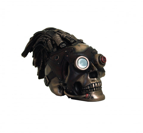Kaukolė steampunk dekoracija, bronzinė, su vienu dideliu lęšiu ir viršuje susuktomis žarnelėmis, parodyta iš šono
