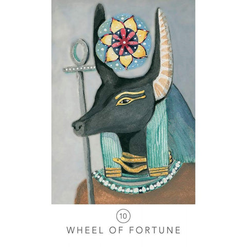 tarot korta Wheel of Fortune: juoda Anubio galva su mėlynais ir aukso akcentais, skirta likimo skaitymui