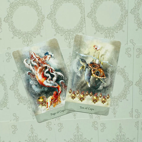 tarot kortos — Page of Cups ir Ten of Cups akvarelinės iliustracijos, kortų priekiai ant ornamentuoto šviesaus fono