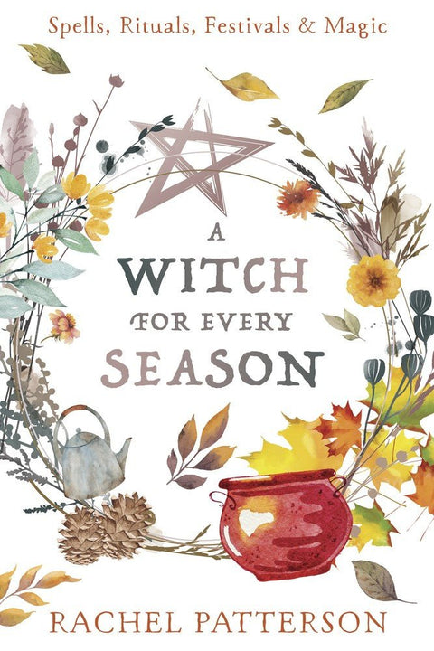 knyga "A Witch for Every Season" su akvarelinio vainiko viršeliu, rudeniškomis gėlėmis, pentagrama ir raudonu katilu