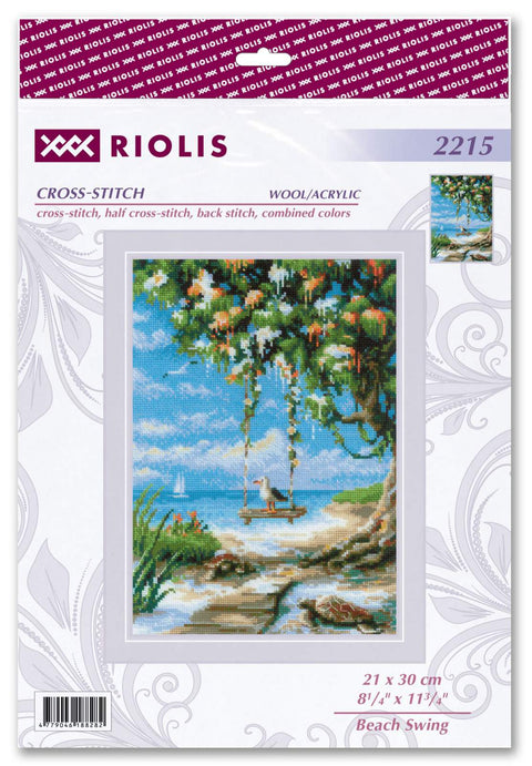 kryželių siuvinys Riolis 21×30 cm Beach Swing — supantis kiras prie jūros po žydru debesuotu dangumi, ryškios mėlynos ir žalios spalvos