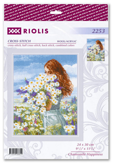 Kryželių rinkinys Riolis, moteris su ramunėlių puokšte pievoje, vilna/akrilas, galutinis dydis 24×30 cm