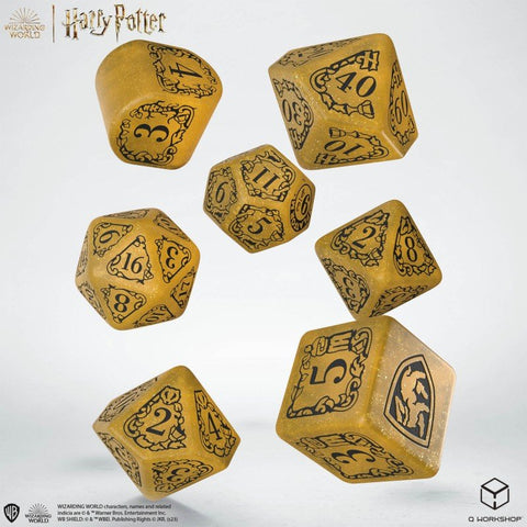 Kauliukų rinkinys Harry Potter — auksiniai blizgantys polihedronai (d4–d20) su juodais skaičiais ir Herbo emblema