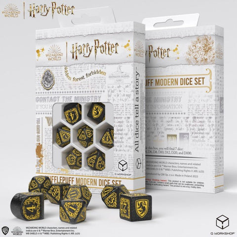 Hufflepuff kauliukų rinkinys (Harry Potter) — juodi su auksinėmis girliandomis, pakuotėje su atviru langeliu ir keli išrikiuoti priekyje
