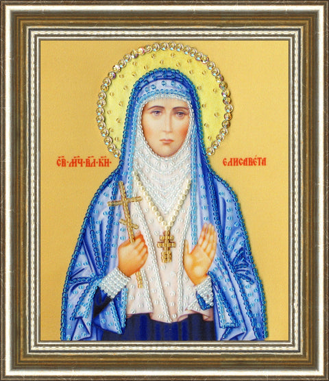 Ikona perlais siuvinėta rėminė, mėlynos drapiruotės, auksinė aureolė ir puošnus aukso rėmas, artimas priekinis kampas