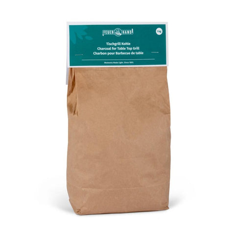 Grilio anglys Feuerhand 1 kg kraft popieriaus pakuotėje, skirtos staliniam griliui, aiškiai matoma viršutinė etiketė
