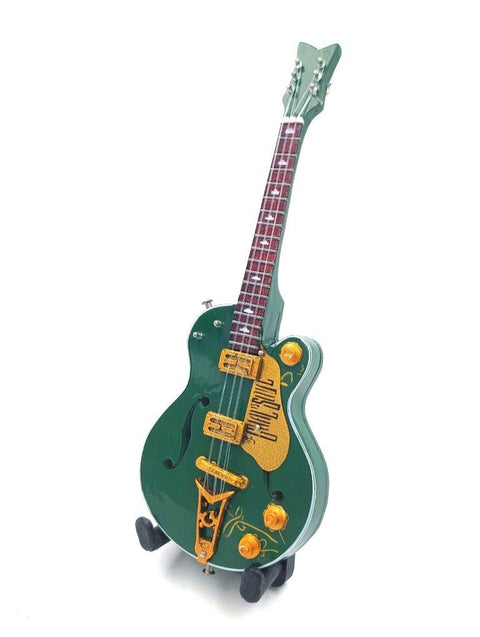 Elektrinė gitara žalsvo lako pusiau kiaurame korpuse su auksinėmis detalėmis, raudonu grifu ir stoveliu