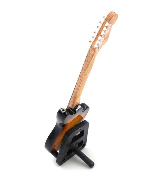 elektrinė gitara miniatiūra, riešuto spalvos korpusas ir natūralaus medžio kaklas, stovėjimo laikiklyje iš šono