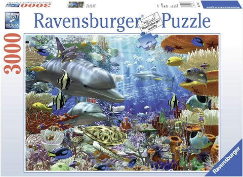 Puzlė Ravensburger 3000 det., spalvingas povandeninis peizažas su delfinais ir vėžliu ant dėžutės priekinio plano