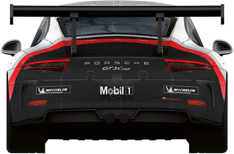Dėlionė Porsche GT3 Cup, juoda‑balta su raudonomis juostomis, matoma galinė dalis su dideliu sparnu ir Mobil1/Michelin logotipais