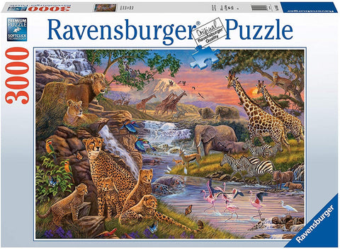 Ravensburger 3000 dalių dėlionė – dėžutės viršelis su spalvinga Afrikos gyvūnų panorama prie krioklio