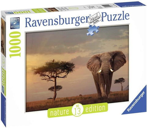 Dėlionė Ravensburger 1000 det., Nature edition, dėžutės priekinė pakuotė su drambliu saulėlydžio fone