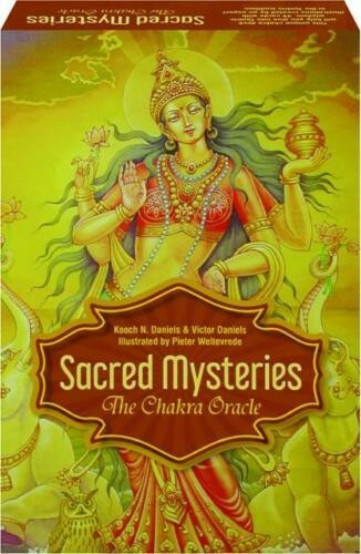 Chakrų orakulas „Sacred Mysteries“ – 78 kortų rinkinys su geltonu ornamentuotu viršeliu ir dievybės iliustracija