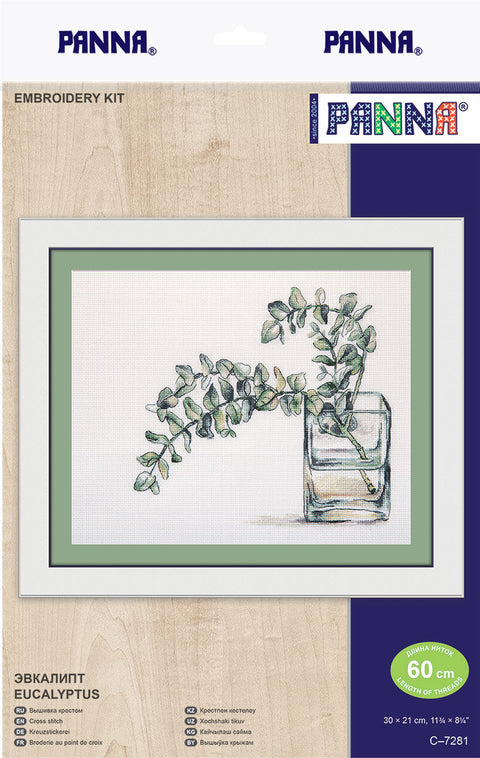 Kryželių rinkinys PANNA Eukaliptas, rodo įrėmintą žalių eukalipto lapų kompoziciją stiklinėje vazelėje, 30×21 cm