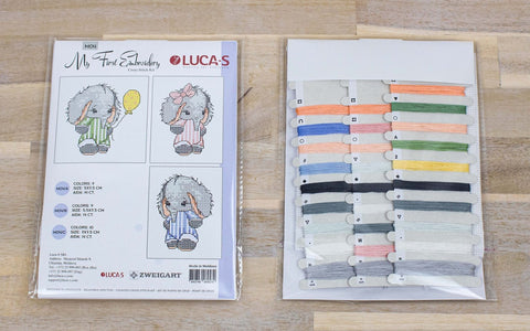 Siuvinėjimo rinkinys LUCA-S su trimis mažų drambliukų kryželių schemomis ir 18 spalvų siūlų kortele