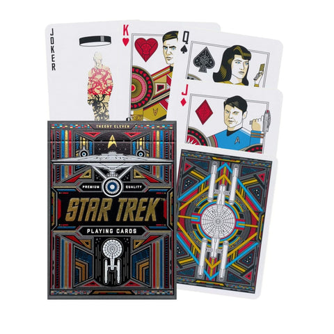 Star Trek kortos juodame auksiniame dėkle, su spalvotomis nugarėlėmis ir iliustruotomis figūromis bei dėklo priekio dizainu