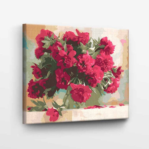 Drobė su ryškiai raudonų gvazdikų puokšte, įtempta ant medinio rėmo (40×50 cm), matomas 3 cm šoninis kraštas
