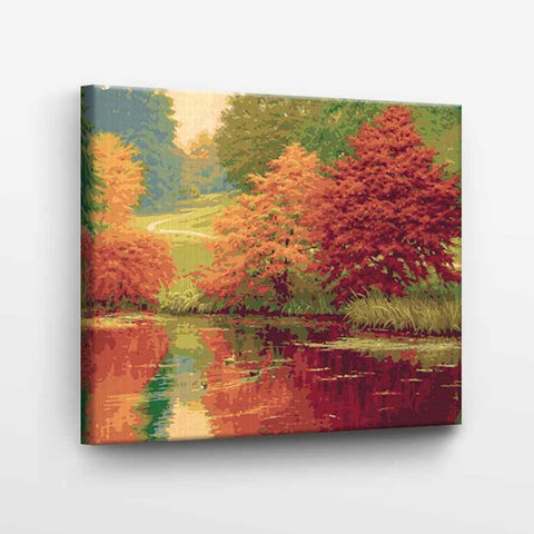 Drobė rudens peizažas, ryškiai raudonos ir žalios spalvos, 60×40 cm, rodoma iš kampo su tūriu rėmu, drobės tekstūra matoma