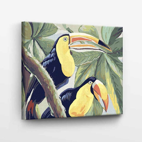 Drobė su tropiniais tukanais, geltonai–tamsiai mėlyna paletė, 60×60 cm, šoninis kampinis rodinys atskleidžia įtemptas kraštines ir gylį