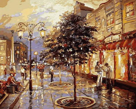 miesto peizažas ant drobės, šiltų rudi-aukso tonų vakarinė gatvė su šviesų atspindžiais, 50×70 cm