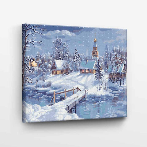 Drobė su žiemos kaimo peizažu, 40×30 cm, kampinis rodymas atskleidžia įtemptą rėmą ir atspausdintus šonus