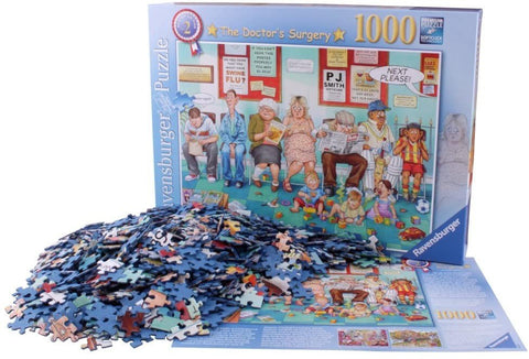 Dėlionė Ravensburger 1000 detalių, mėlynos tonų nukritusios detalės prie dėžutės, matoma laukiančia iliustracija