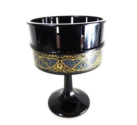 Saldaininė ant pjedestalo juodos spalvos su aukso ornamentu, blizgi apdaila ir viršutine grotelių anga