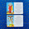 tarot kortos Rider–Waite stiliaus: dvi kortos (Three of Cups ir Two of Cups) ant mėlyno žvaigždėto fono, aiškinimo tekstai matomi