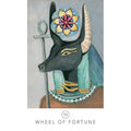 tarot korta Wheel of Fortune: juoda Anubio galva su mėlynais ir aukso akcentais, skirta likimo skaitymui