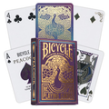 Bicycle kortos Peacock, violetinė dėžutė su auksiniu povų raštu ir išfaneruotos kortos, matomos nugarėlės bei figūrinės kortos