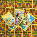 tarot kortos Egipto tematika, trys atverstos geltonu kraštu kortos centre ant spalvingų nugarėlių, rodo 6–8 Lazdų kortas