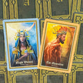 Tarot kortos parodo dvi priekinės kortas iš viršaus: mėlynos "Night Women" ir oranžinės "The Masculine" su ornamentuotu kortų fone