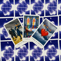 Tarot kortos Swords rinkinio: Three of Swords, Four of Swords ir Five of Swords išdėstytos ant mėlynos žvaigždėtos nugarėlės