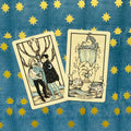 tarot kortos — dvi atverstos kortos (Ace of Cups ir Two of Cups) ant mėlyno fono su geltonomis žvaigždėmis