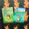 Orakulų kortos su dviem atvertomis kortomis — žalia Earth Magic ir mėlyna Connect with Water ant liepsnojančio nugarėlių fono