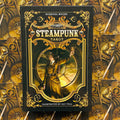 Steampunk taro kortos, dėžutės priekinis viršelis juodas su auksiniais ornamentais, Barbara Moore tekstas ir Aly Fell iliustracija