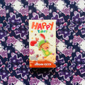 Happy Tarot kortos (Serena Ficca) priekinė spalvinga dėžutė su linksmu piešiniu, centre ant violetinio debesų fono