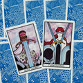 Tarot kortos rinkinys – parodytos Swords kortų priekinės versijos: Ace of Swords ir Two of Swords, mėlyni bangų nugarėlių raštai