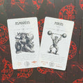 tarot kortos komplektas su baltomis iliustruotomis Asmodeus ir Foras kortomis, parodytas priekis ir skirtingi dizainai