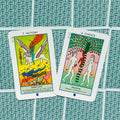 Tarot kortos — dvi atverstos spalvotos kortos (7 Victory/Ambition ir 6 Choice/Passion) ant žalsvo raštuoto fono