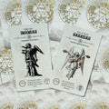 tarot kortos baltame fone su auksiniais sigilais, dvi kortos (Imamiah ir Hahasiah) matomos iš viršaus