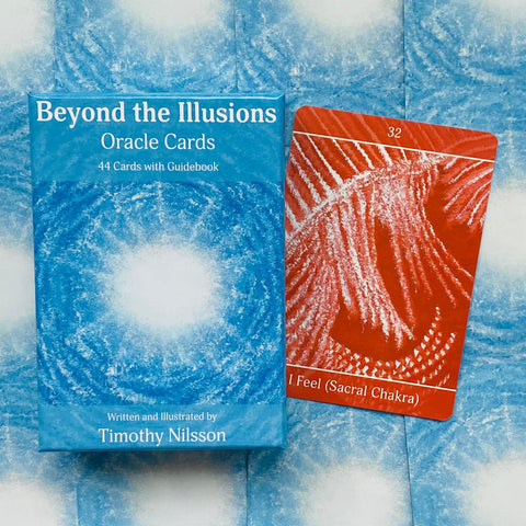 Orakulų kortos "Beyond the Illusions" mėlyname dėkle, šone raudona 32 numerio "I Feel (Sacral Chakra)" korta