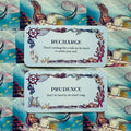 Orakulo kortos su undine: dvi baltos kortos (Recharge, Prudence) ant mėlyno jūrinio fono, rėmai su žuvimis ir kriauklėmis