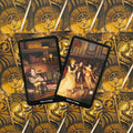 tarot kortos dviejų atverstų kortų – Four of Cups ir Three of Cups ant auksinio mechaninių ratų nugarėlės fono