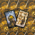 Tarot kortos steampunk dizainas: dvi atvertos kortos (Eight of Cups ir Seven of Cups) ant auksinio mechaninio fono