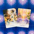 Orakulų kortos dviejų kortų išklotyje: Key of Light ir Merkaba Spiritual Protection ant mėlyno spindinčio fono