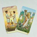 Tarot kortos – dvi persidengiančios Taurių kortos (2 ir 3) su antikiniu, ryškiu iliustraciniu stiliumi ir kampiniu išdėstymu