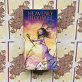 Produktų puslapyje – priekinis Heavenly Bloom tarot kortų dėžutės viršelis, centrinis stačiakampis kadras su pasteline rožine ir auksine gėlių fono kortele