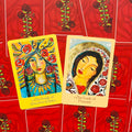 Oracle kortos: atverstos Our Lady of Creative Choice ir Our Lady of Passion, geltoni ir kreminiai rėmai